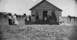 This 1873 photograph shows the infamous Bender Inn the day after the grave digging began.