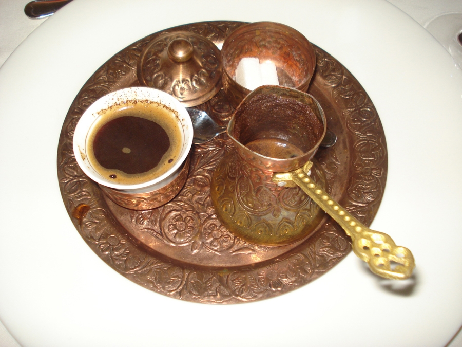 Turkish coffee set  containing a cup of coffee, a coffee pot and a sugar bowl