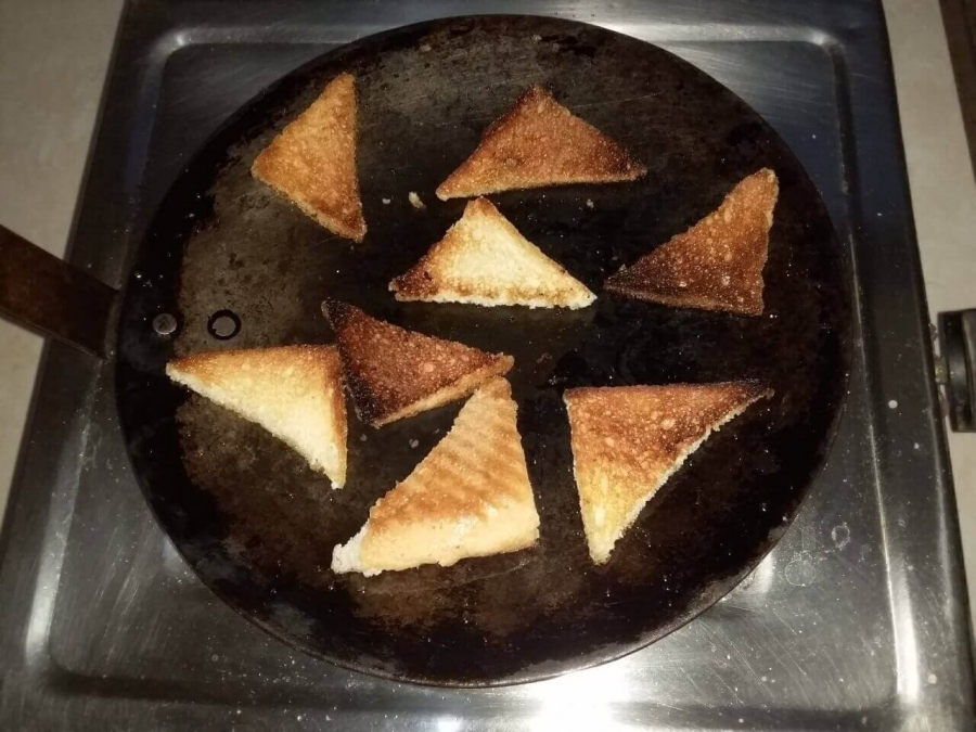 Golden Brown colour of bread pieces after completion of frying in Recipe of Shahi Tukda.