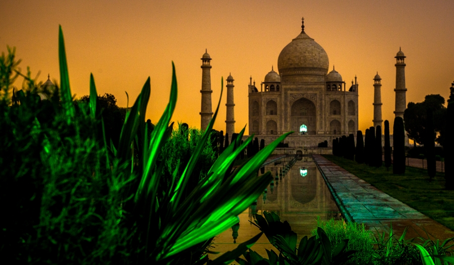 Taj Mahal in Midnight with City Lights illuminating the background