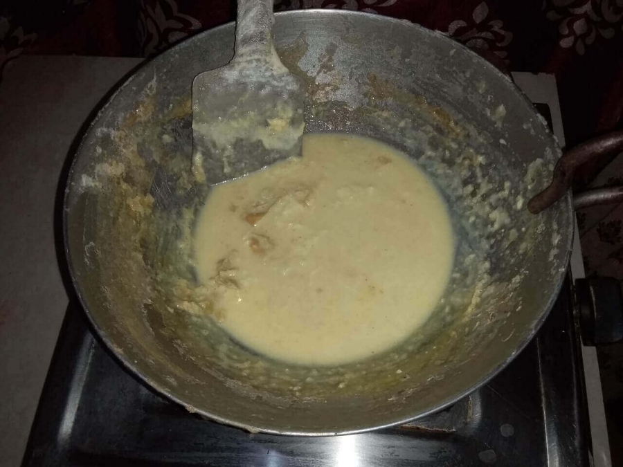 Lachha being mixed to hot concentrated sweetened milk in Recipe of Rabri.