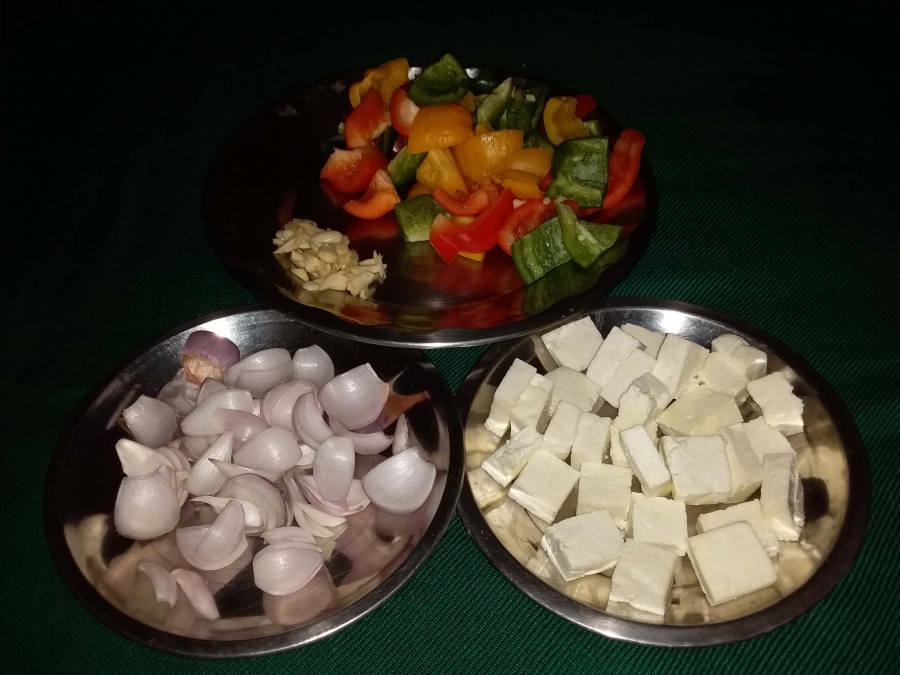 Cut vegetables and Paneer in Chilli Paneer Dry Recipe.