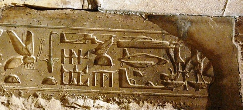 Hieroglyphs showing seemingly modern aircraft and vehicles depicted on a riser in a temple in Abydos, Egypt.