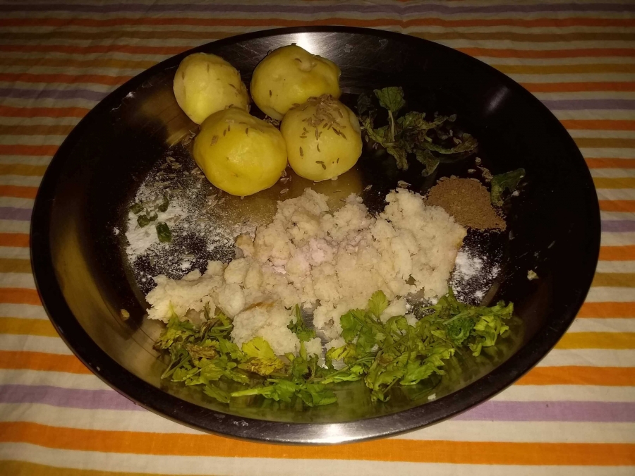 Boiled Potatoes & other ingredients before mixing in Recipe of Aloo Tikki.