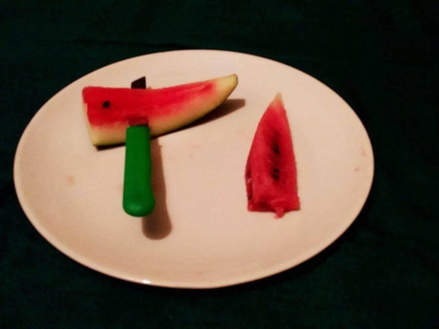 Of the 2 portions shown previously, the lower piece again cut by separating the inner red region from outer skin as described in Watermelon Juice Recipe preparation.