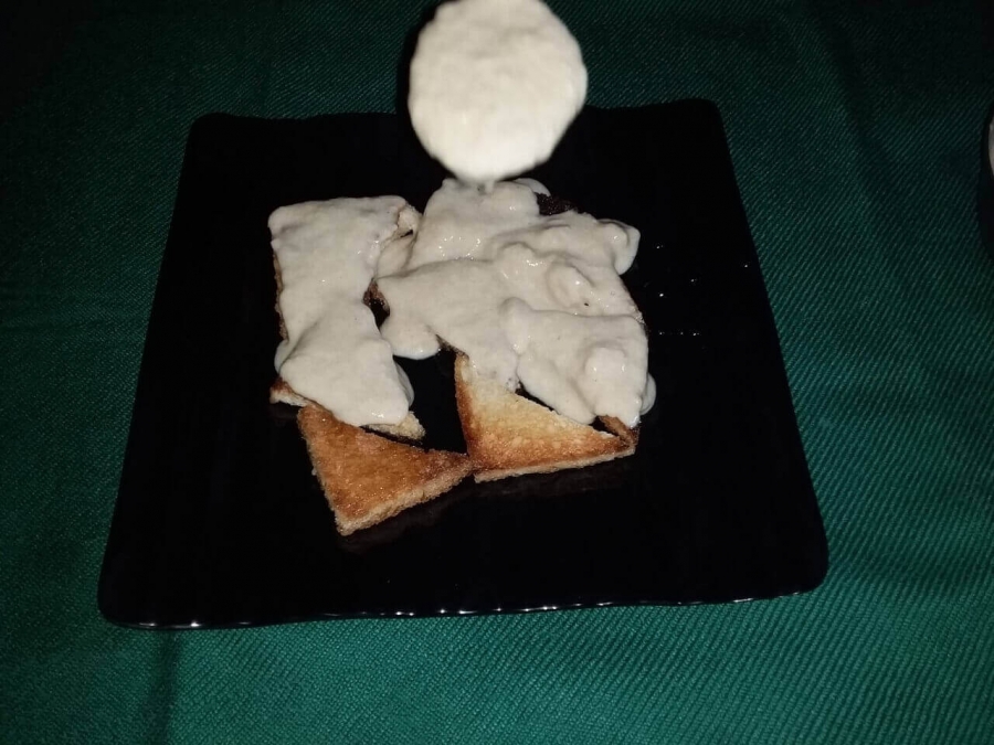 Bread preparation being covered in Rabri as described in Recipe of Shahi Tukda.