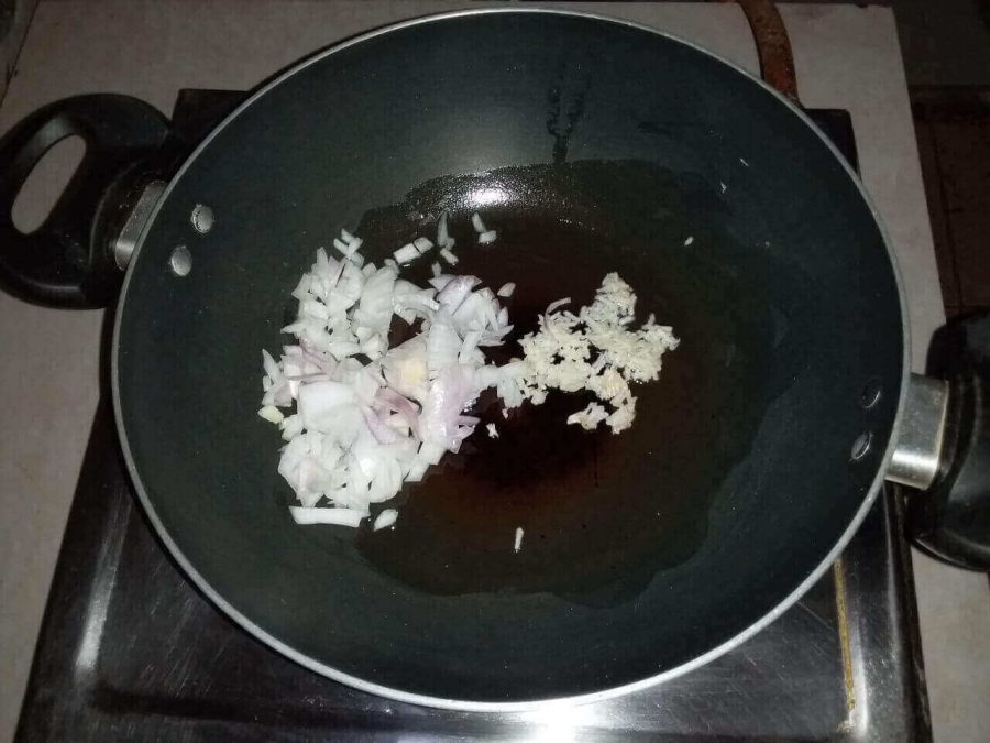 Garlic & Onion being fried in Recipe of Vegetable Soup.