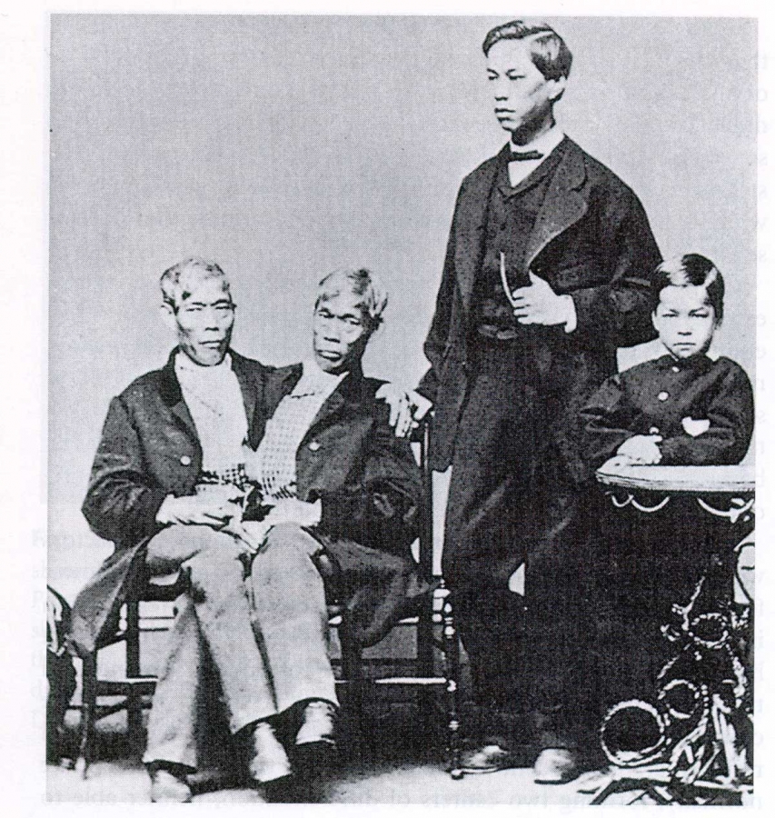 Photograph of Chang and Eng Bunker with two of their sons.