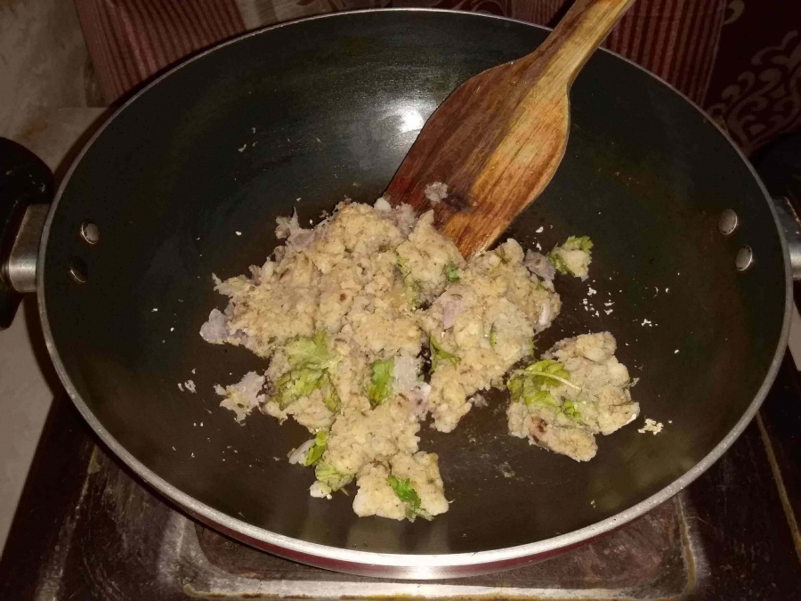 Potatoes (Aloo) being fried with all other ingredients in Potato Cutlet Recipe.