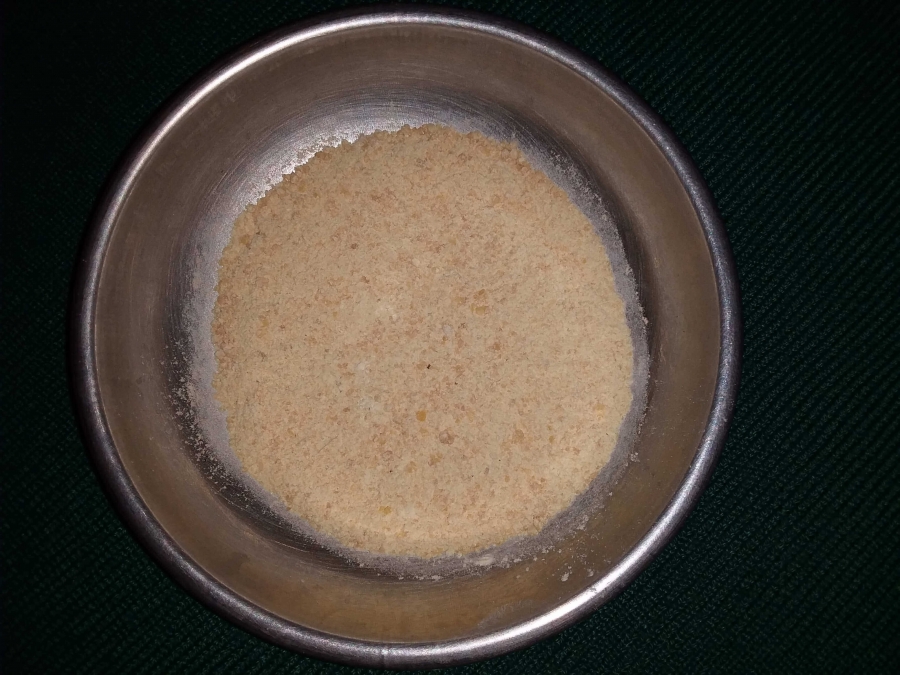 Powdered Moong Dal after grinding in Moong Dal Halwa Recipe.
