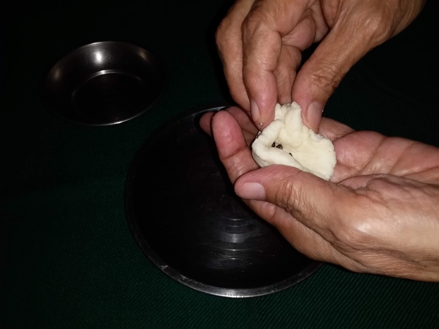 Making balls from the dough pieces in  Recipe of Gulab Jamun with Khoya