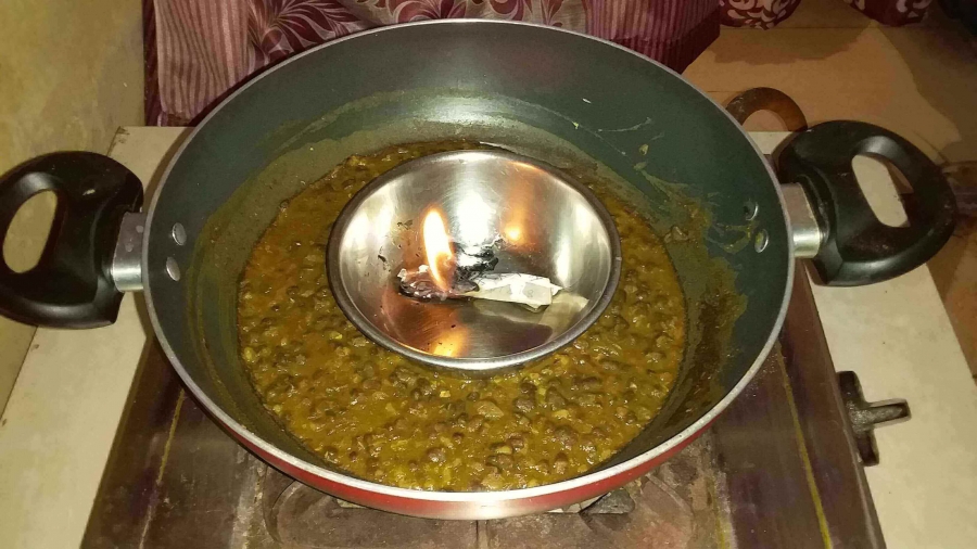 Charcoal burning step in Dal Makhani Recipe.