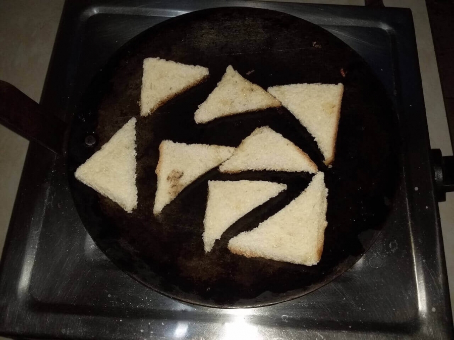 Bread pieces put on Tawa for frying as described in Recipe for Shahi Tukda