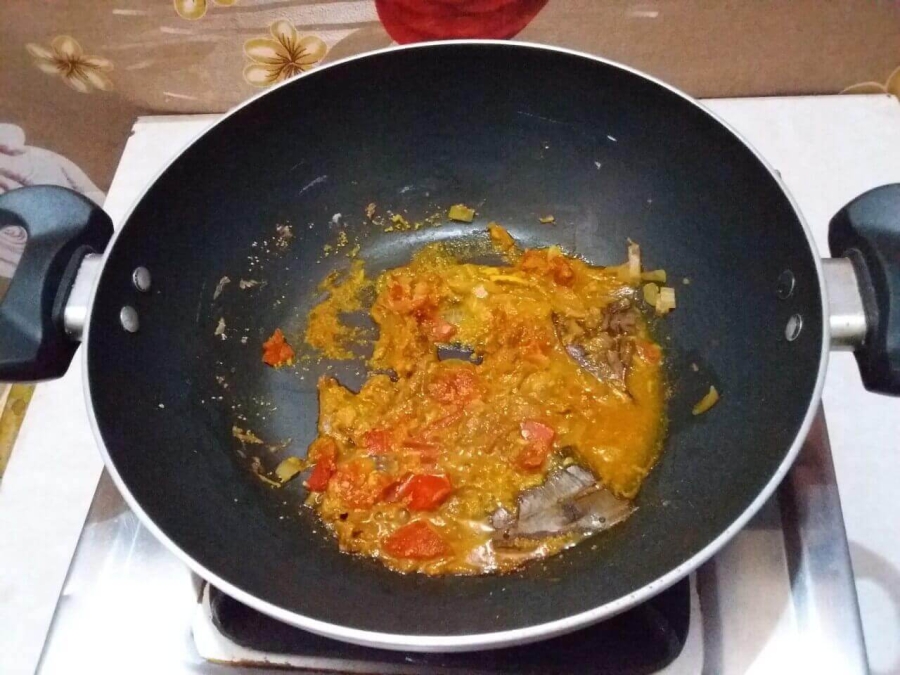 Frying the Masalas & Onion, Tomato pieces, Garlic & Ginger paste with Poppy seed paste as described in Rohu Fish Kalia Recipe.