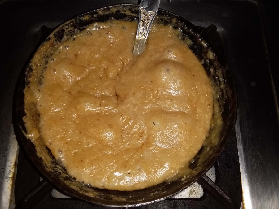 The final consistency of the preparation before turning off the burner in Recipe for Moong Dal Halwa.