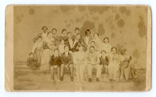 Chang & Eng Bunker with their wives and 18 children & Slave (Grace Gates).