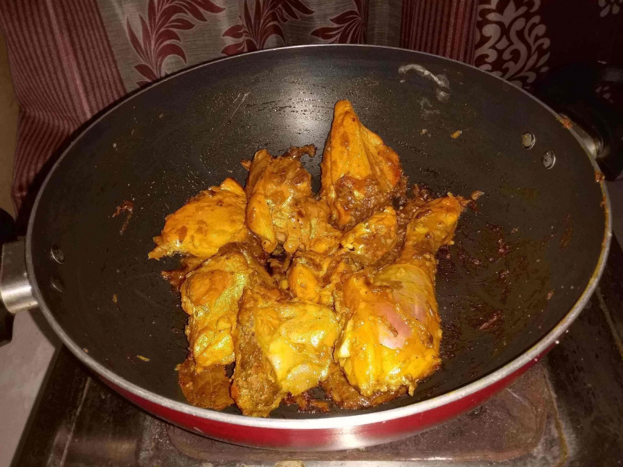 Chicken curry being prepared.