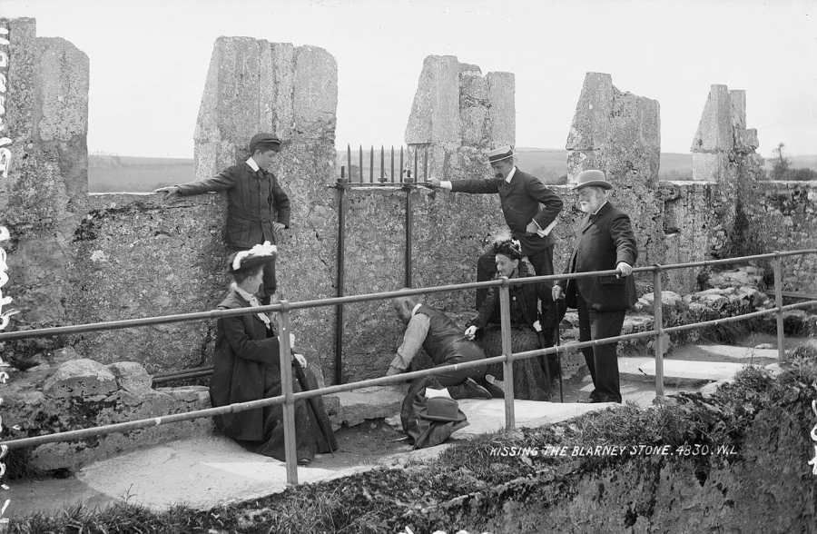 Kissing the stone in 1897, before the safeguards were installed.