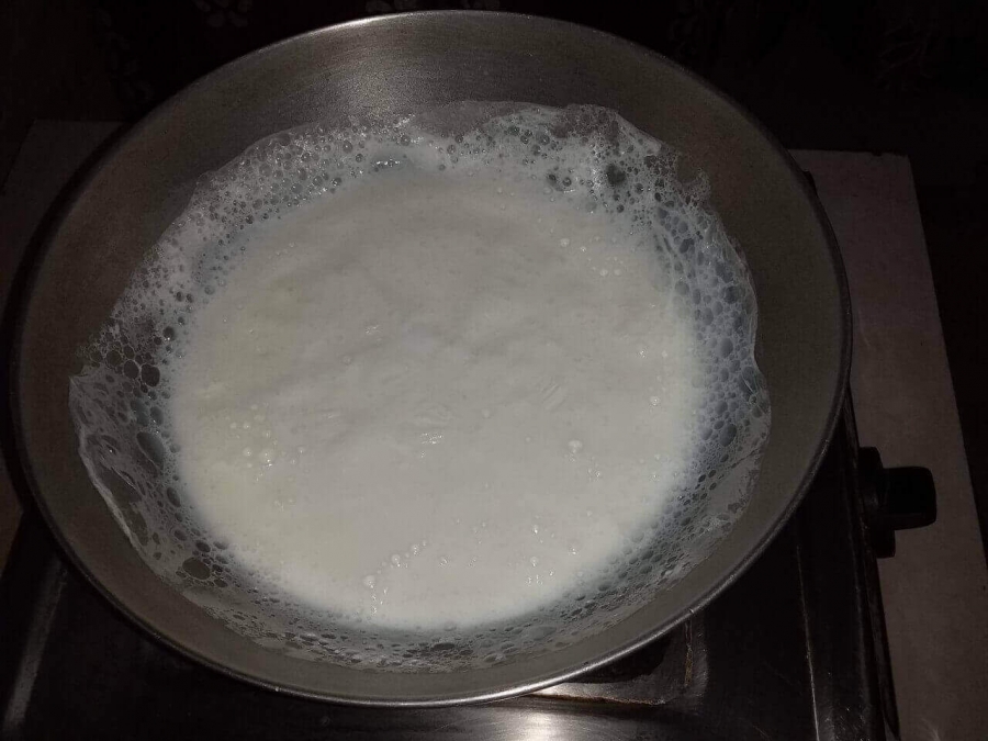 Boiling the milk  to concentrate it in Recipe for Rabri.