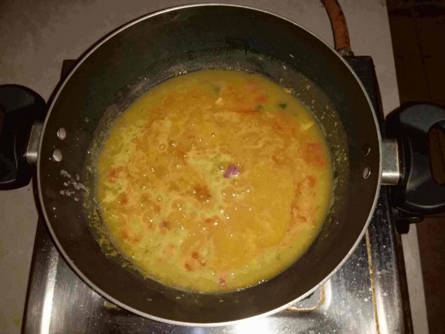 Dal being cooked with fried Onion, Garlic, Tomato & Green Chilli in Recipe of Dal Palak.