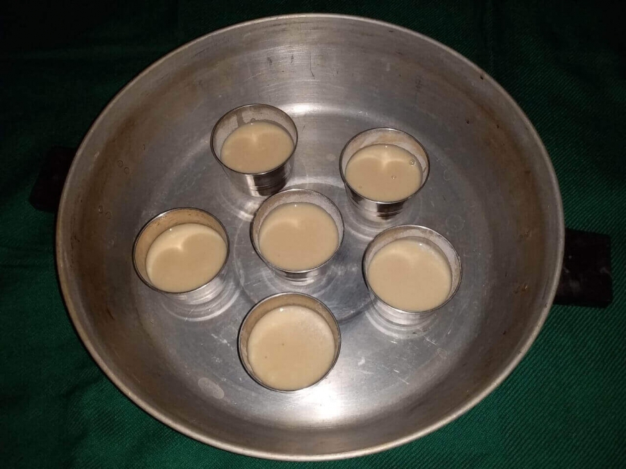 Batter in molds,  put inside baking oven for baking in Recipe of Muffin.