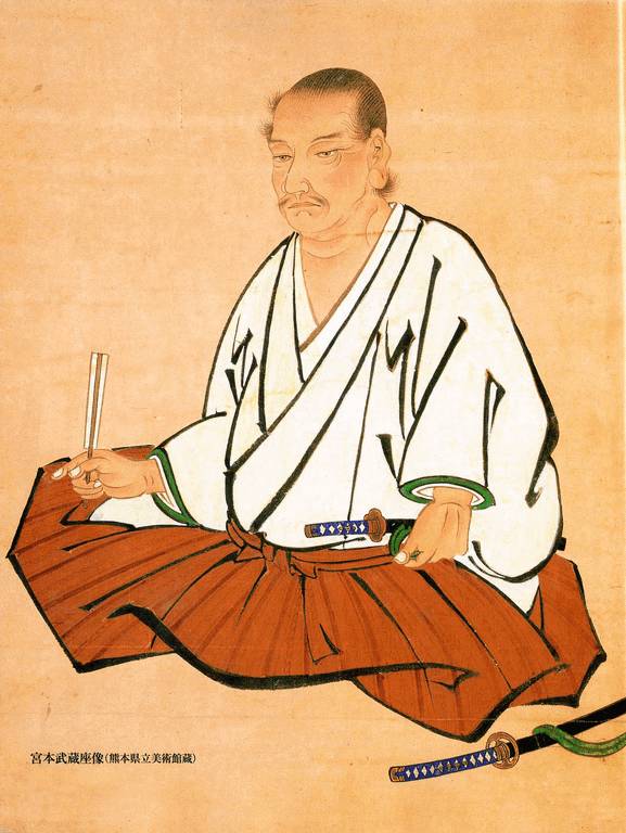 Seated figure of Miyamoto Musashi.