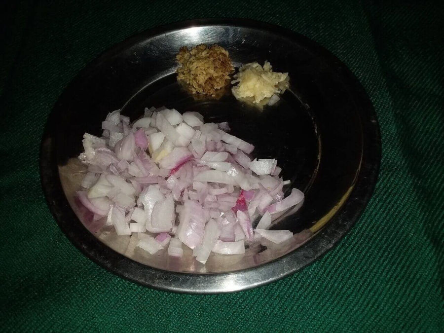 Ginger & Garlic Paste with cut onion pieces used in Recipe for Fish Kalia.