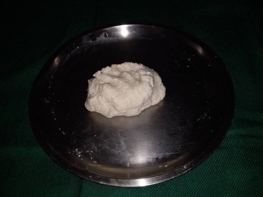 Texture of dough (Chenna mixture) used in Chenna Poda Recipe.