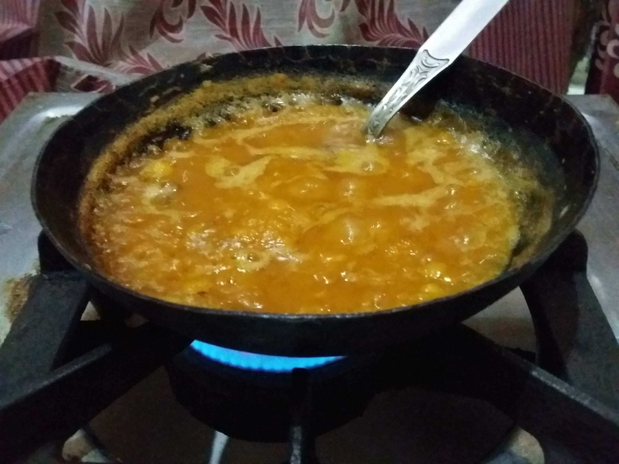 Cooking mashed dal with Jaggery In Recipe of Puran Poli.