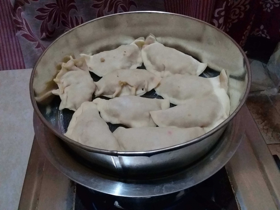 Preparing Chicken Momos by Steam Heating.