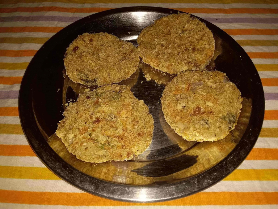 The preparation covered in bread crumbs before frying as described in Recipe for Potato Cutlet.