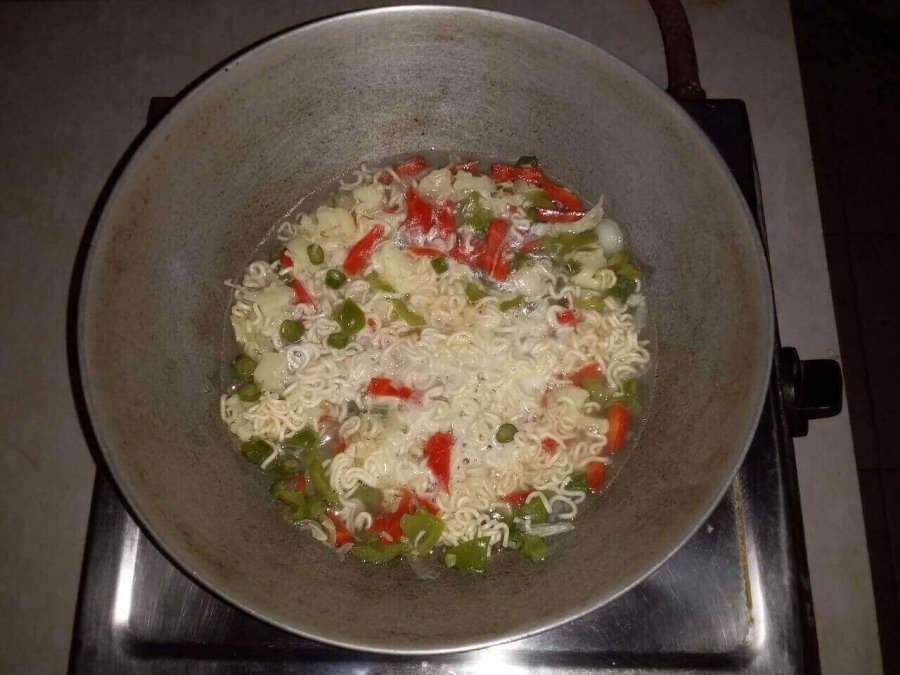 Noodles & vegetable mixture being boiled in Recipe of Vegetable Soup.