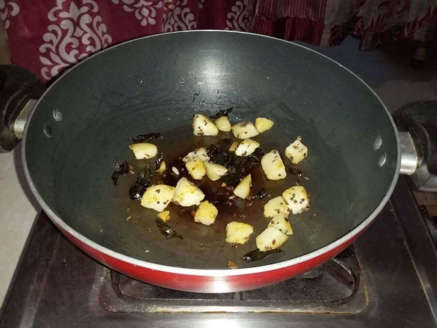 Potato pieces being fried in Recipe for Sabudana Khichdi.