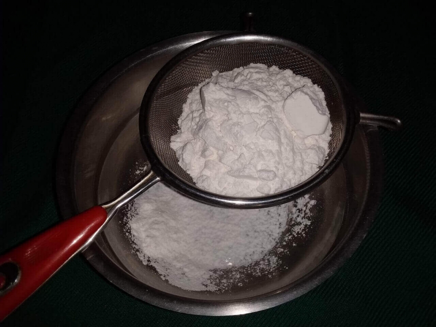 Flour mixture being sieved as described in Recipe of Muffin.